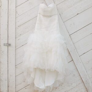 Wedding dress with built in corset and cups. Lace up back.